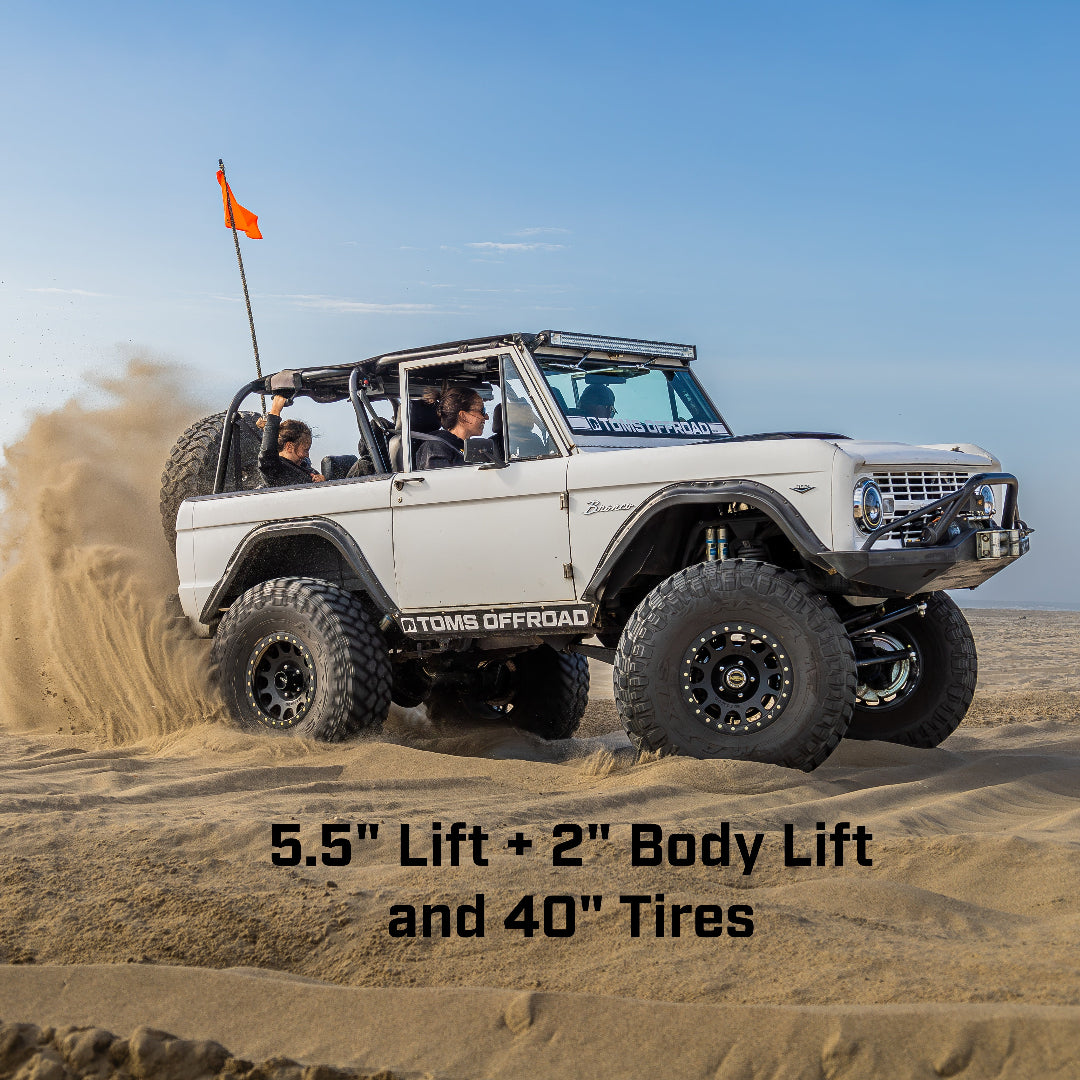 5.5-inch black steel suspension lift kit with heavy-duty shocks, side view