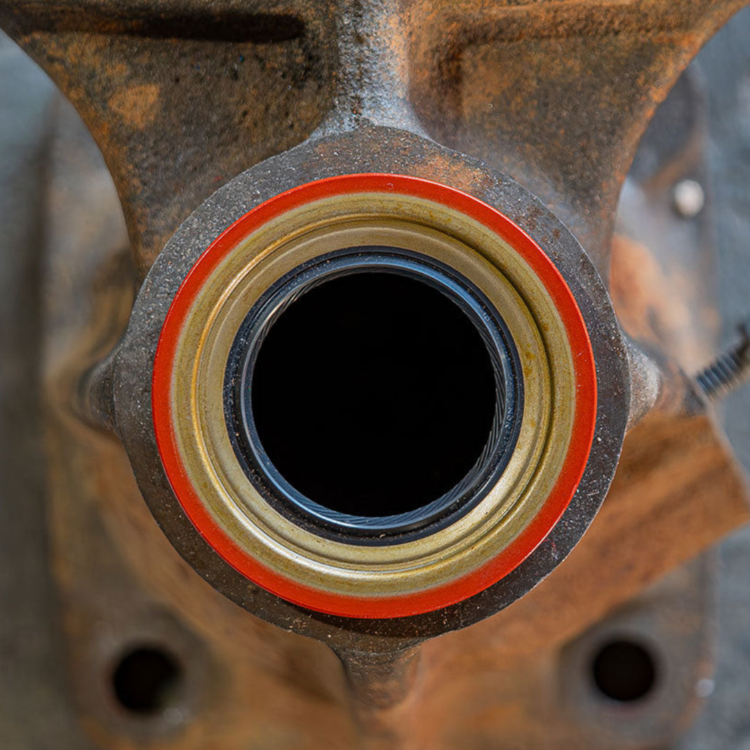 Black rubber tail housing seal for Ford 3-speed and 4-speed transmissions, close-up view