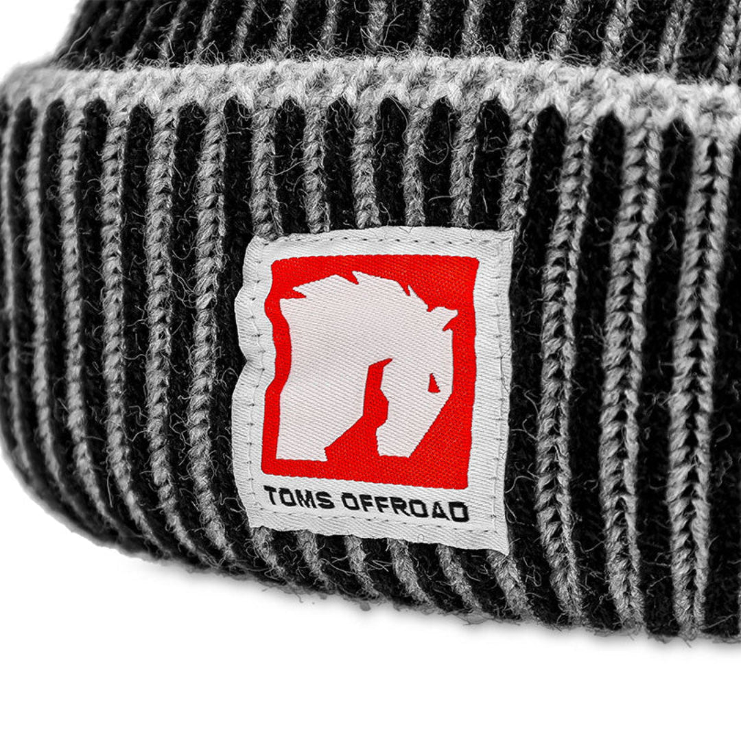 Black and gray knit beanie with TOMS OFFROAD logo, front view