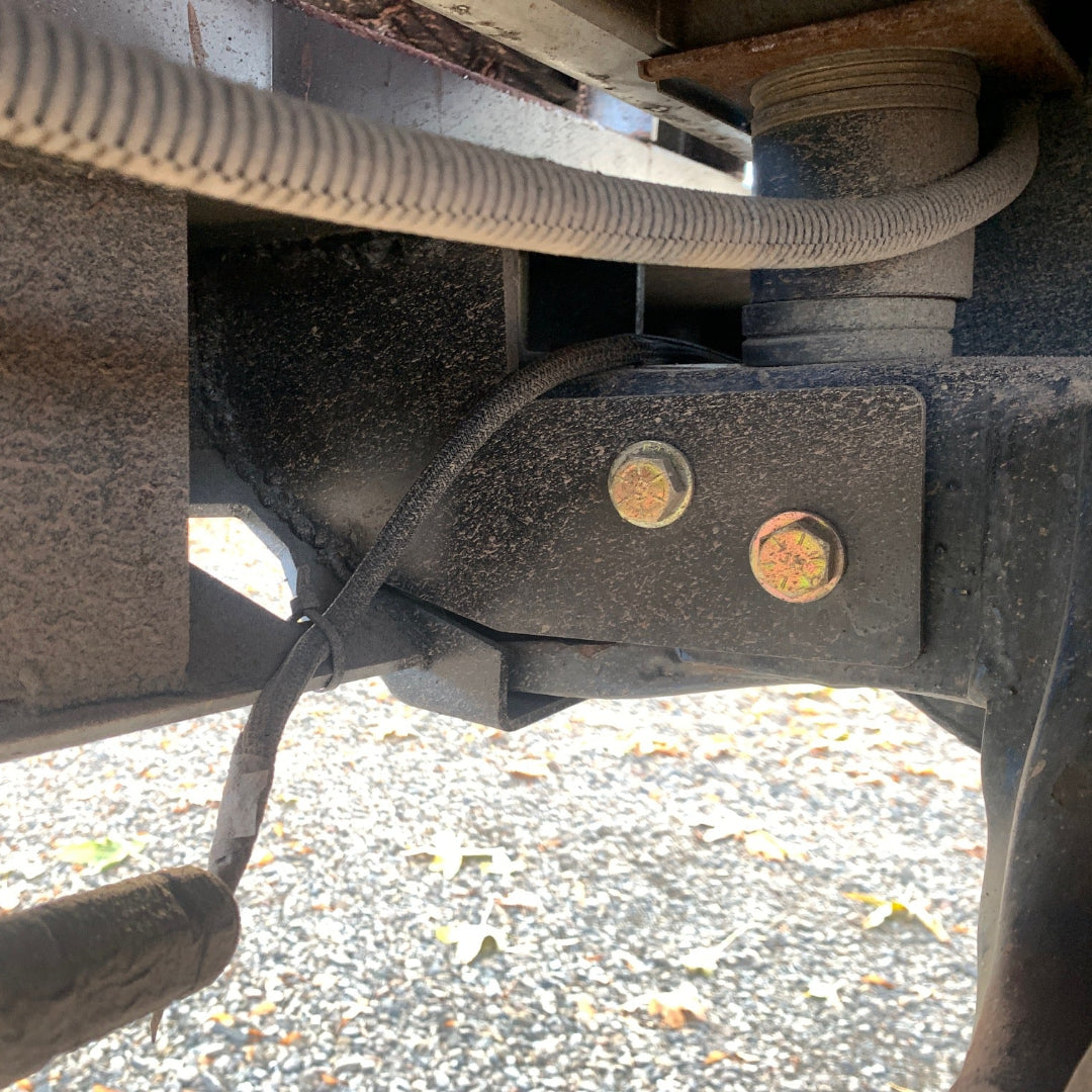 Pair of black steel stiffening braces for rear bumper with mounting hardware, front view