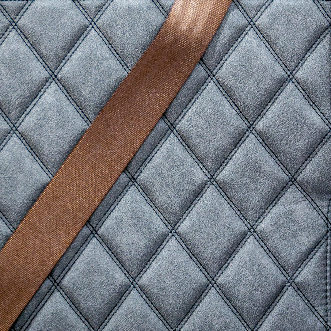 Copper-colored three-point seat belt set with metal hardware for classic Ford Bronco, side view