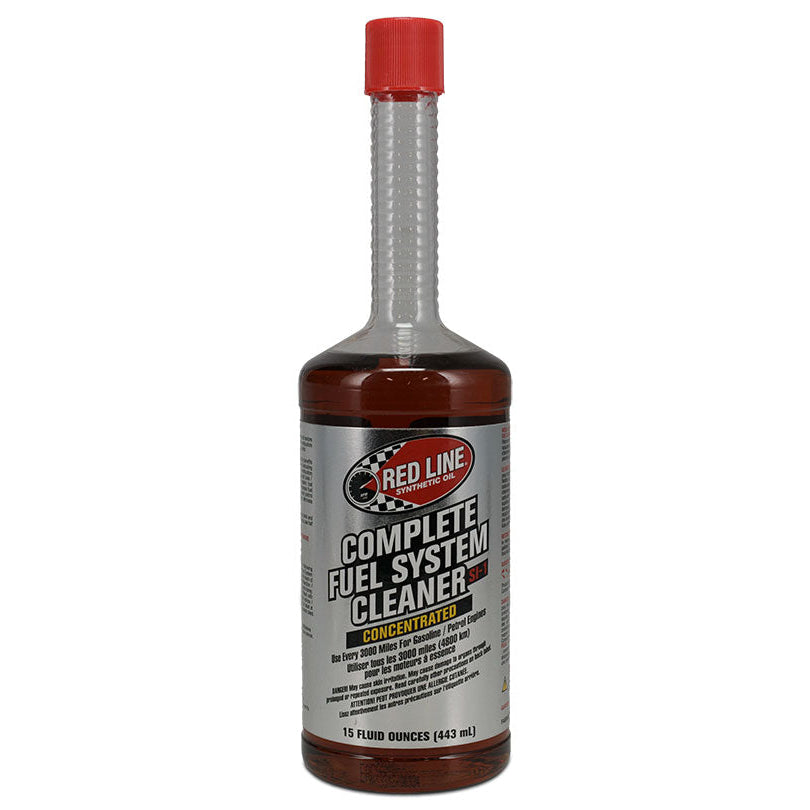 Red bottle of fuel system cleaner with white label and cap, front view