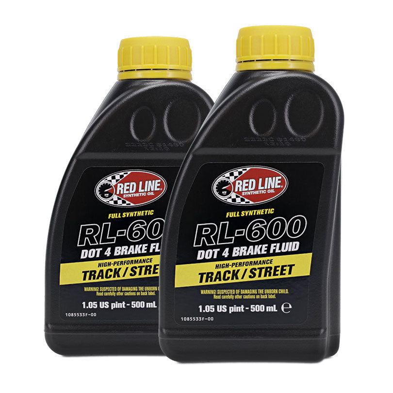 Red DOT 4 brake fluid bottle with white label, front view