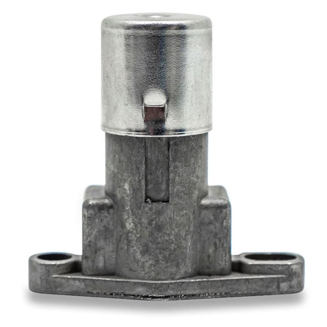 Black plastic headlight dimmer switch with chrome toggle and wiring connectors, front view