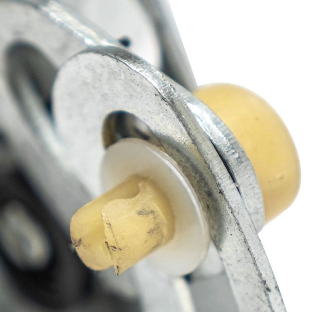 Silver metal door latch with spring mechanism for 1966-67 Ford Bronco, close-up view
