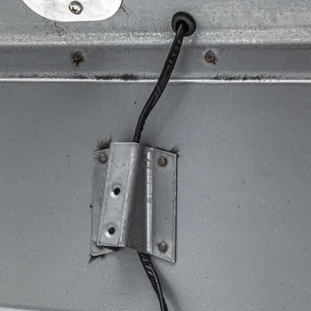 Set of three black rubber grommets for tailgate wiring, side view