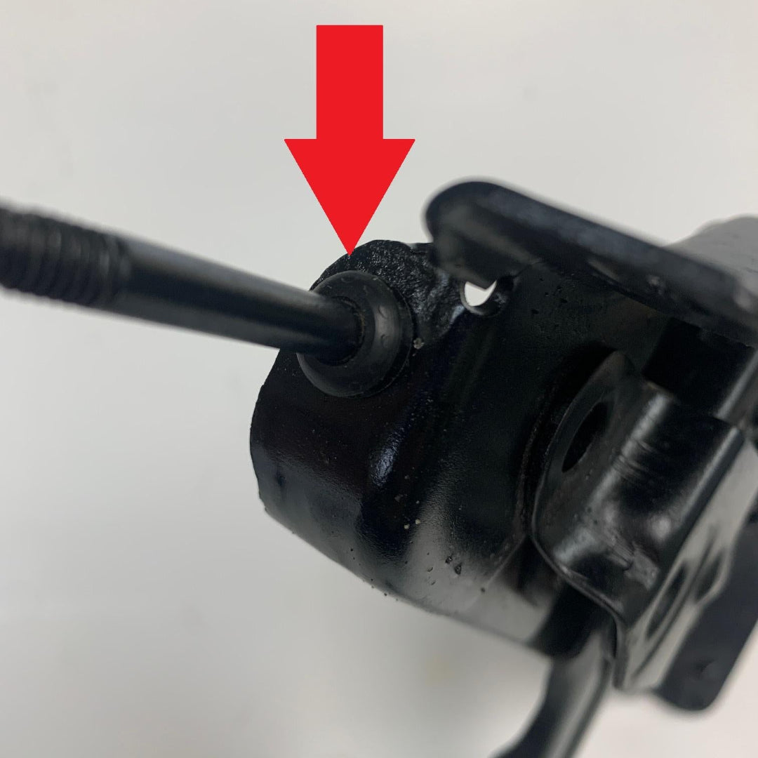 Black rubber brake handle bushing with textured grip, side view