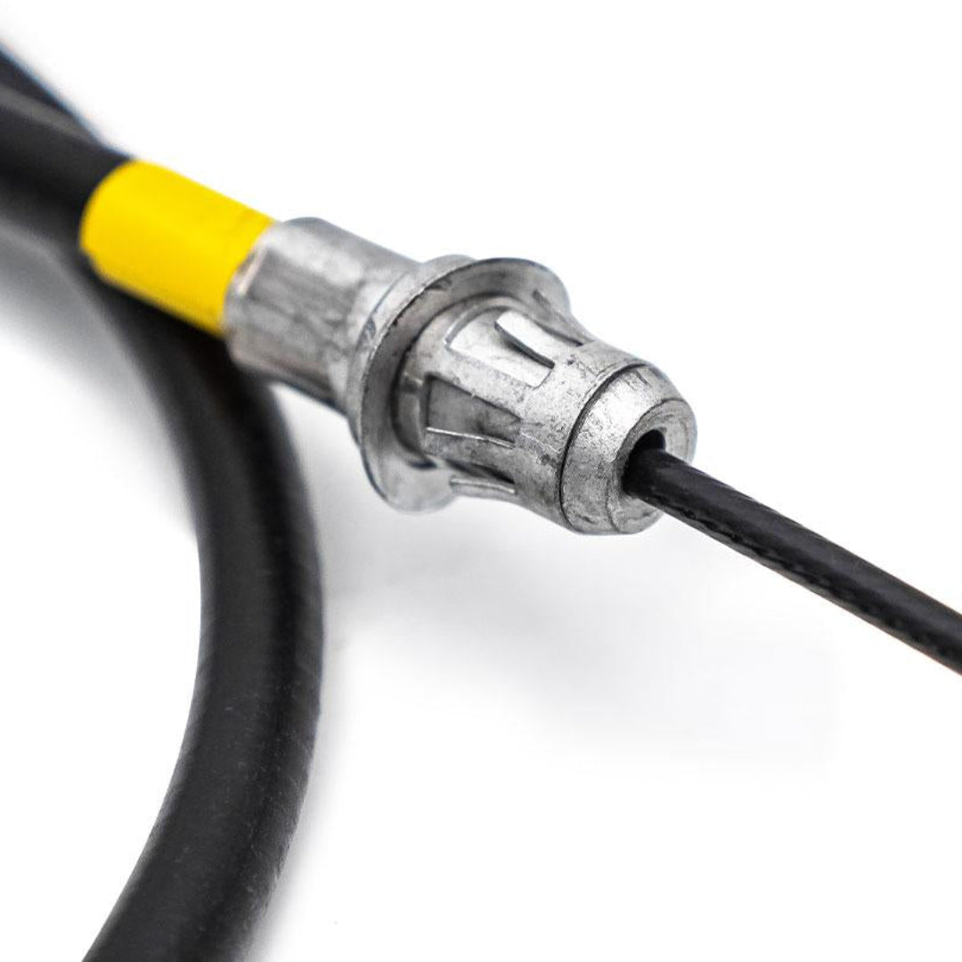 Silver parking brake cable with mounting bracket, driver side view