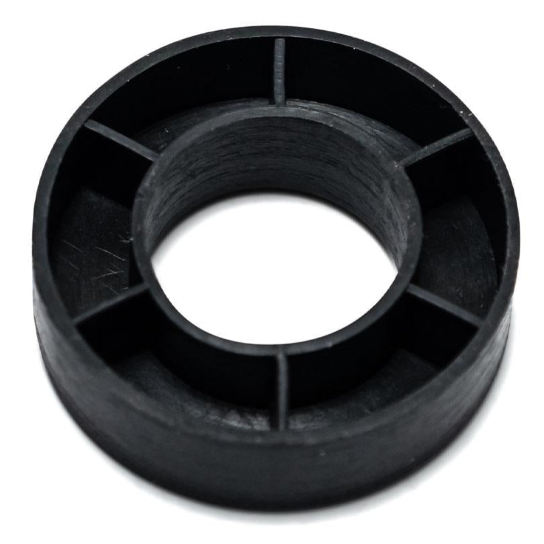 Black rubber horn button cushion pad with textured surface, front view
