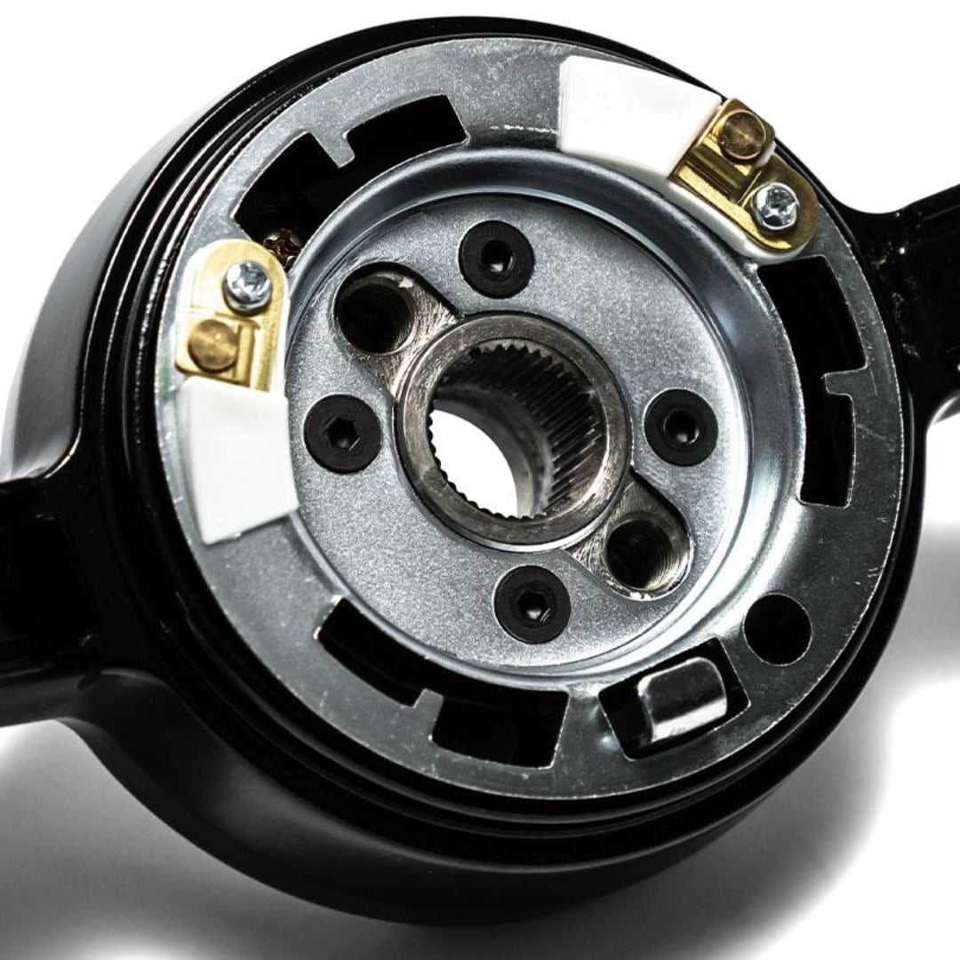 Black leather steering wheel with chrome spokes and perforated grip, front view