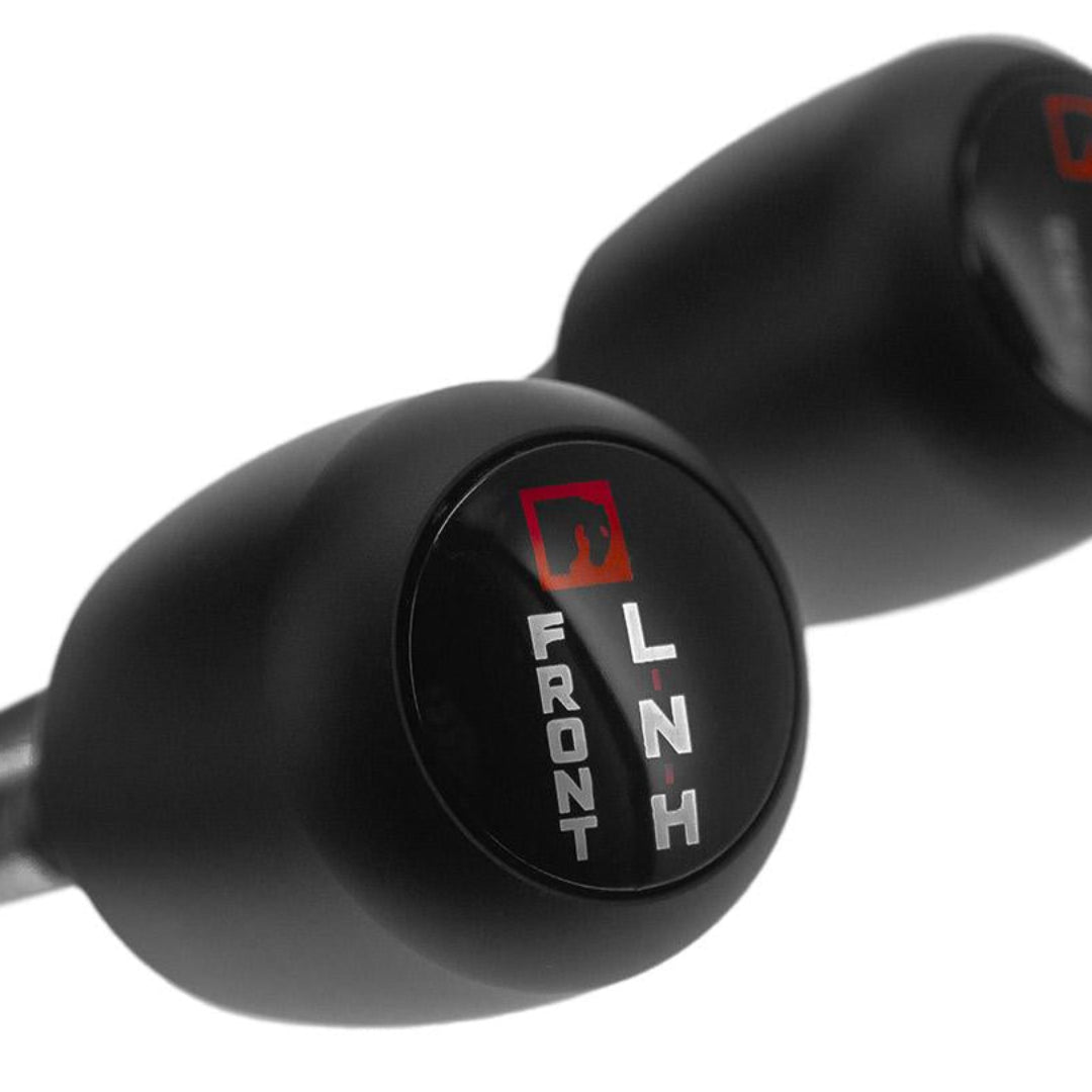 Black T-style twin stick shifter with textured knobs, side view