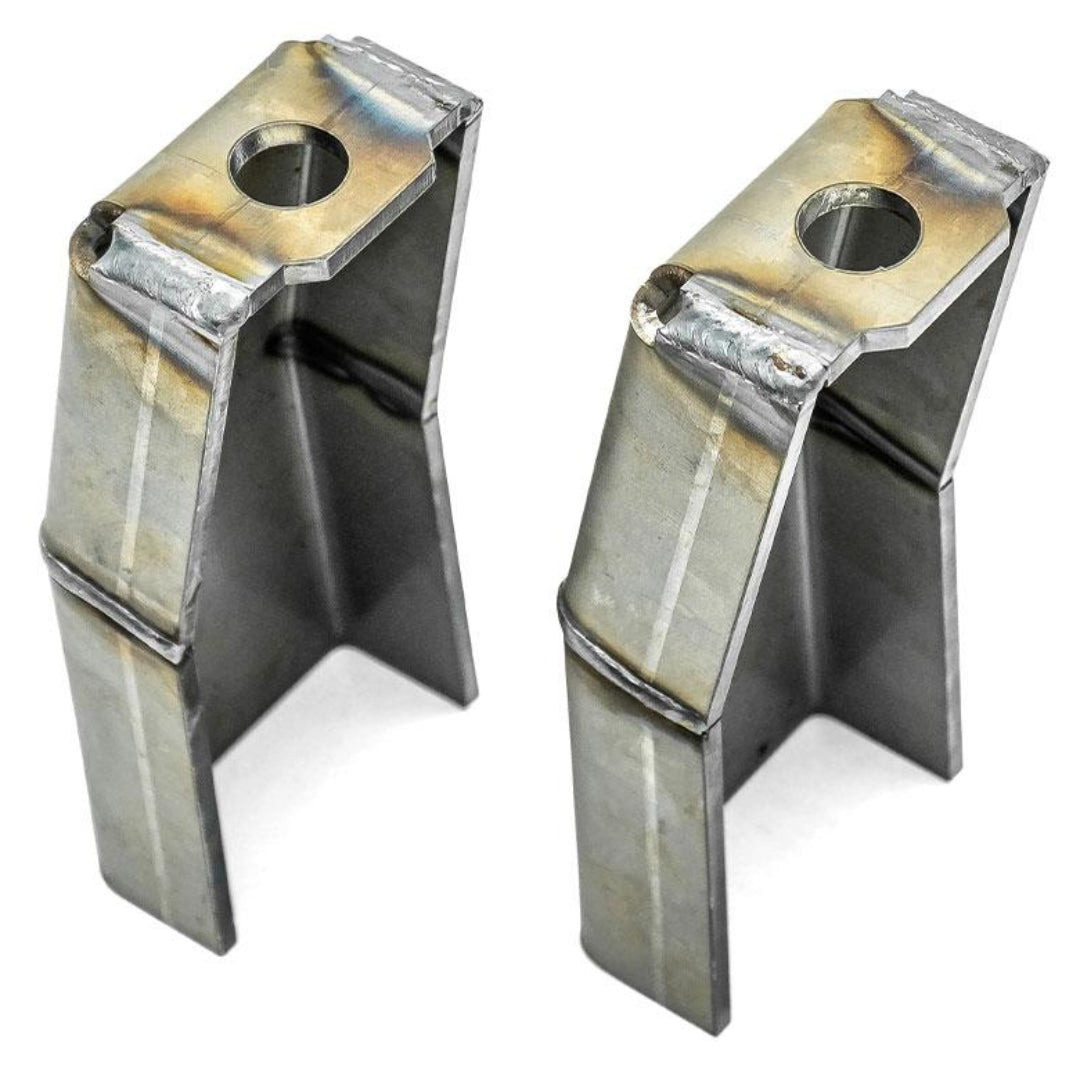 Pair of black steel shock mounts with bolt holes, front view