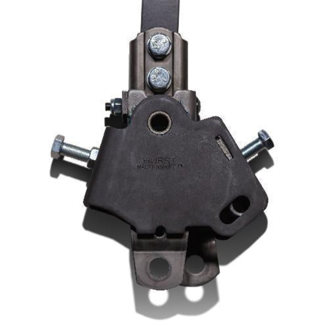 Chrome 3-speed floor shifter with black boot and metal tunnel cover, side view