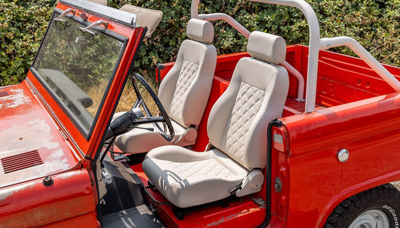 Classic Ford Bronco Restoration Project Showing Parts, Tools, And Bodywork.