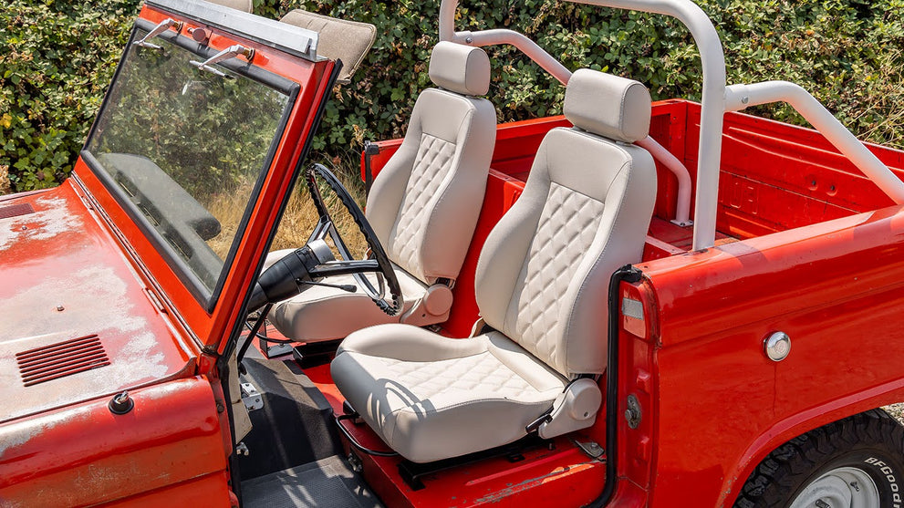 Classic Ford Bronco Restoration Project Showing Parts, Tools, And Bodywork.