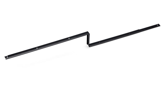 Black metal hold-down strip for driver door carpet, side view