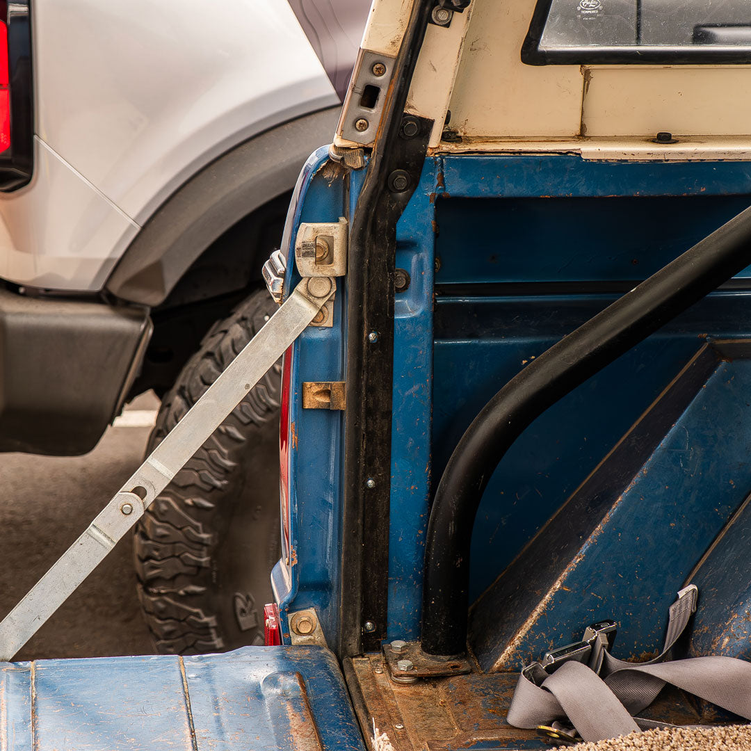Black steel weatherstrip retainers for Ford Bronco tailgate, side view