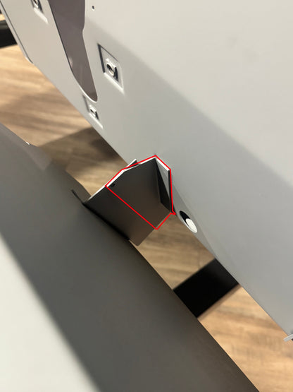Black metal firewall support bracket with bolt holes, side view