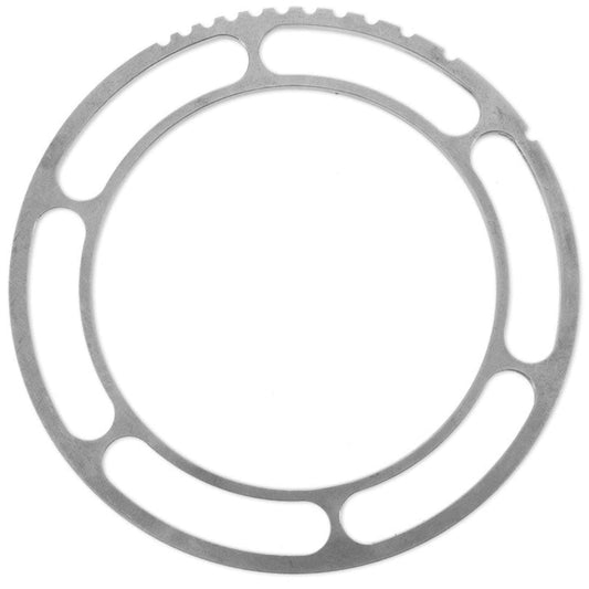Silver metal camber shim with six bolt holes, side view