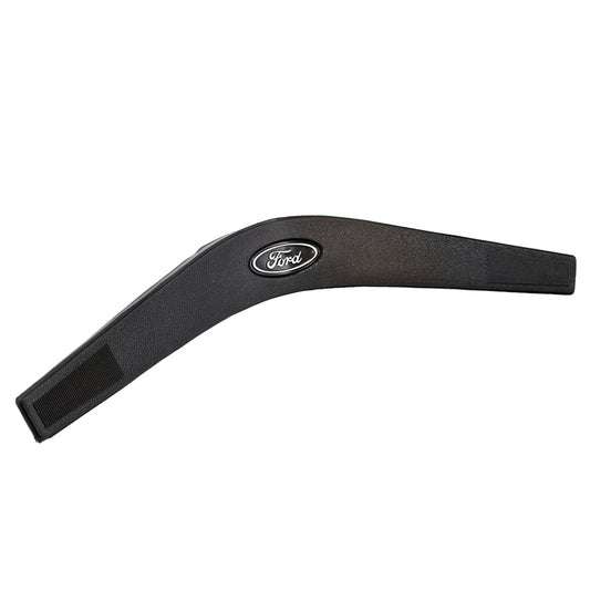 Black steering wheel horn pad with textured grip, close-up view