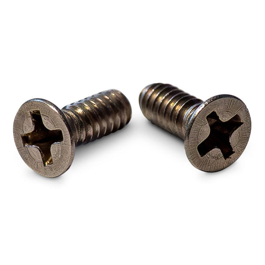 Chrome-plated mounting screws with hexagonal heads for automatic lockout plates, close-up view