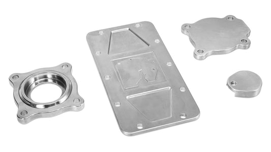Polished aluminum transfer case cover with bolt pattern and smooth finish, front view