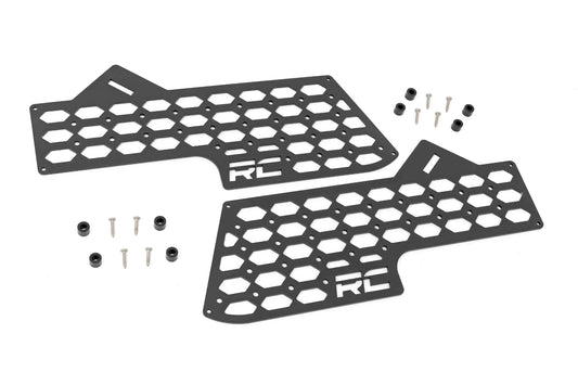 Black metal MOLLE panel for vehicle center console with grid mounting system, side view