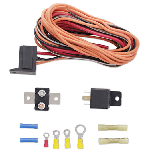Black automotive relay with silver connectors, close-up view