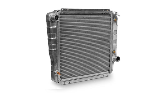 Silver aluminum radiator with three cores and side mounting brackets, front view