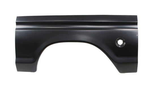 Silver metal truck bedside panel with round filler hole and textured surface, side view