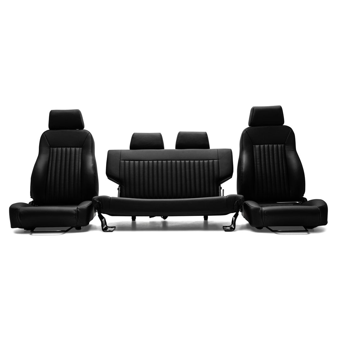 Black leather car seats with diamond stitching and adjustable headrests, front and rear view