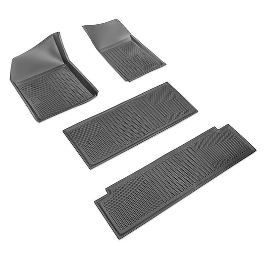Set of four black rubber floor mats with raised edges, front view