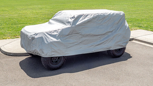 Gray waterproof car cover for Ford Bronco with elastic hem, front view