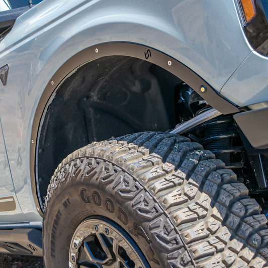 Black metal fender deletes for Ford Bronco, side view
