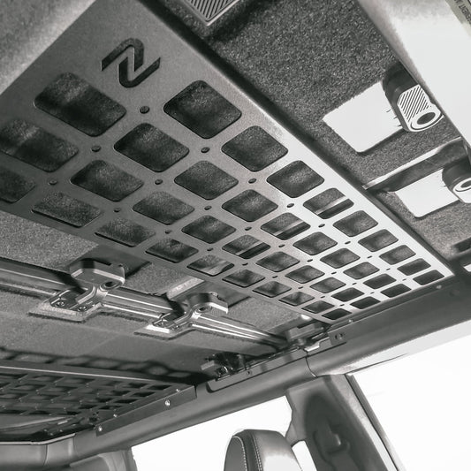Black overhead storage rack for Ford Bronco with mesh pockets, side view