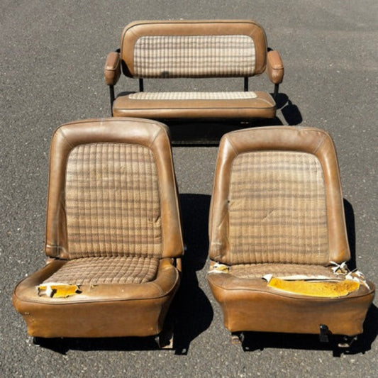 Brown vinyl bucket seats with metal frames, front view