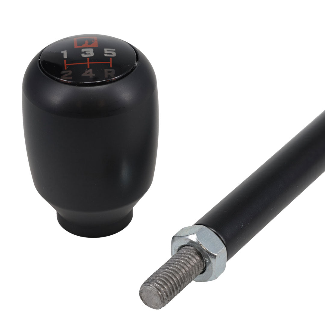 Black shift handle with textured grip and TOMS OFFROAD logo, side view