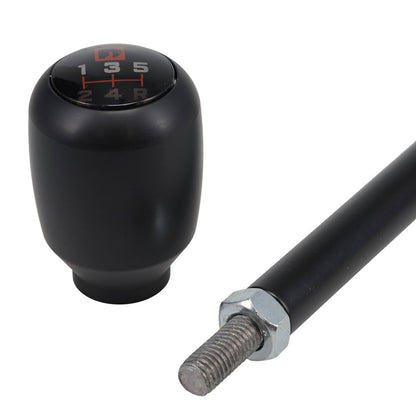 Black shift handle with textured grip and TOMS OFFROAD logo, side view