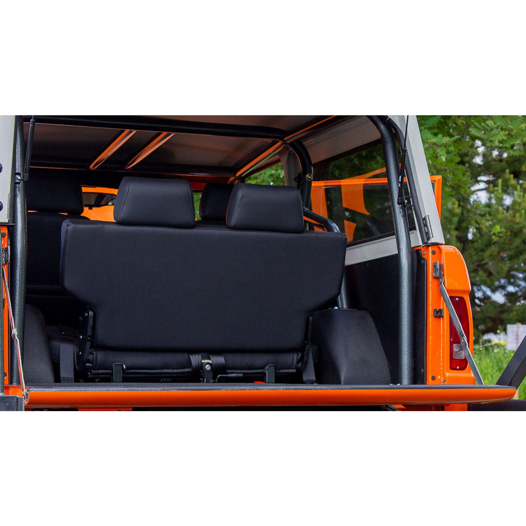 Black leather Bronco seats with diamond stitching and adjustable headrests, front and rear view