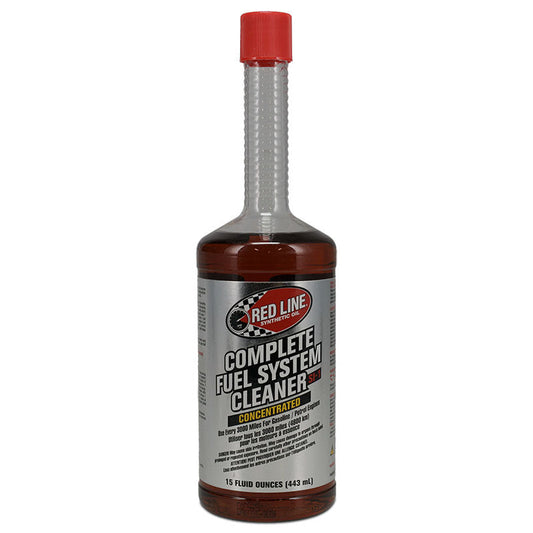 Red bottle of fuel system cleaner with white label and cap, front view