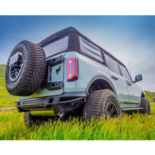 Black steel rear bumper with tow hooks and recovery points, side view