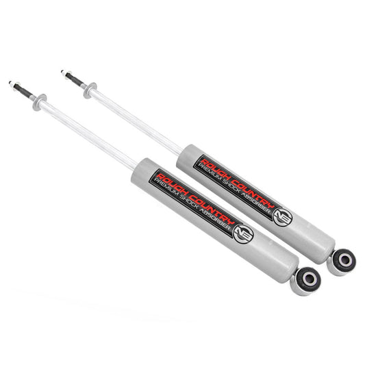 Black 6-8 inch front shock absorbers with red bushings, side view