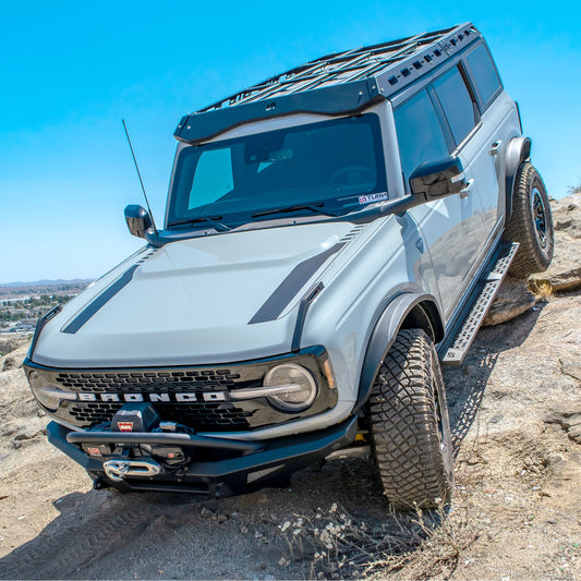 Black steel roof rack with crossbars and mounting hardware for Ford Bronco, front view