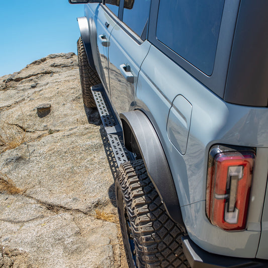 Black steel side steps with textured tread plates for Ford Bronco, side view