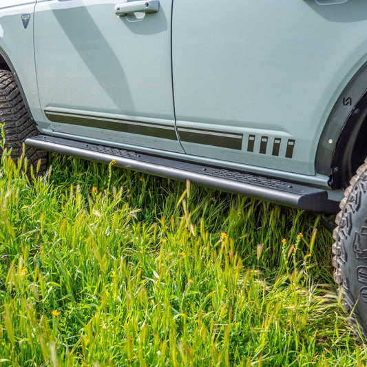 Black steel step slider with textured tread for Ford Bronco, side view