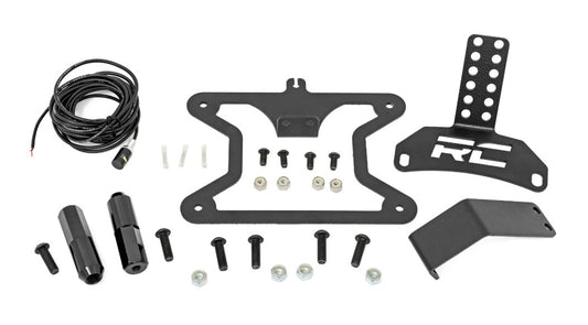 Black metal license plate bracket with mounting holes, side view