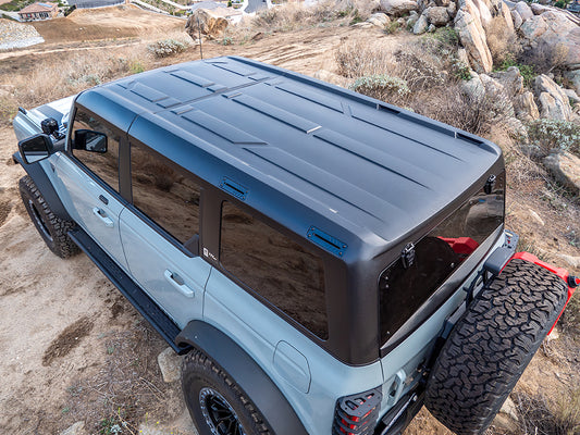 Black hard top for Ford Bronco with side vents, rear view
