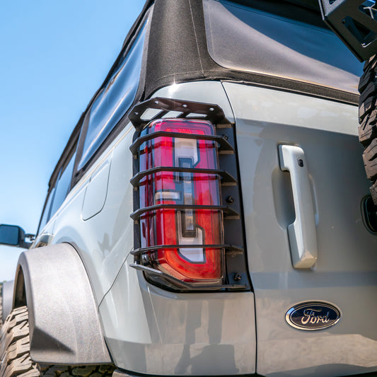 Black heavy-duty tail light guards with honeycomb pattern, rear view