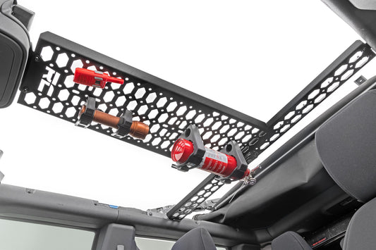 Black metal MOLLE mounting panel with grid pattern for 2021+ Ford Bronco, side view